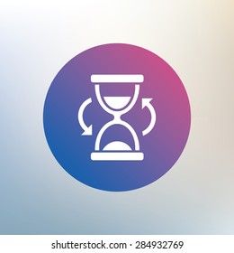 Hourglass sign icon. Sand timer symbol. Icon on blurred background. Vector