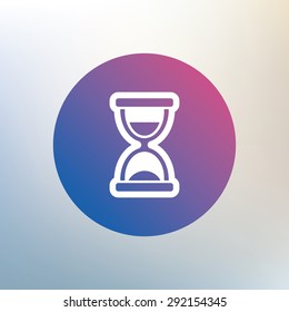 Hourglass sign icon. Sand timer symbol. Icon on blurred background. Vector