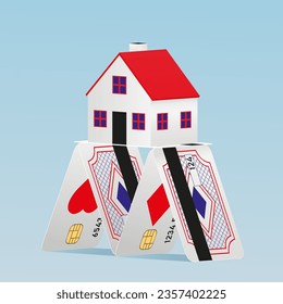 House of cards made from credit cards. A house of cards holds a stone house on top.