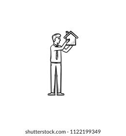 House constructor hand drawn outline doodle icon. Constructor brings house in arms as real estate construction concept. Vector sketch illustration for print, web and infographics on white background.