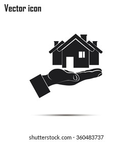 House in hand vector icon.