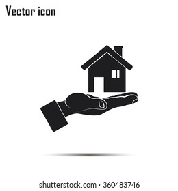 House in hand vector icon.