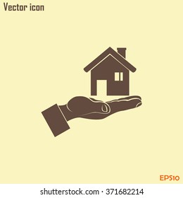 House in hand vector icon.