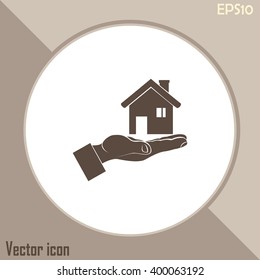 House in hand vector icon.