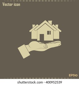 House in hand vector icon.