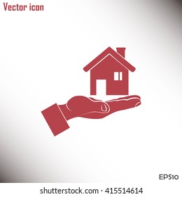 House in hand vector icon.