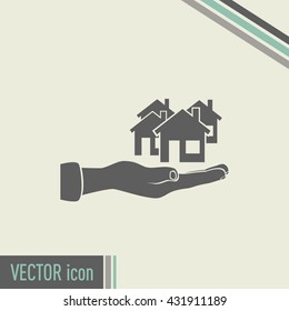 House in hand vector icon.