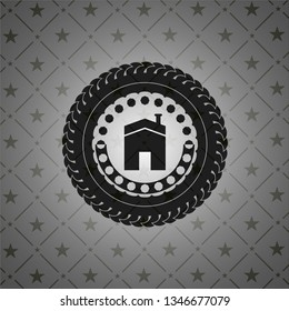 house icon inside black badge
