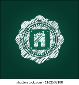house icon inside chalk emblem written on a blackboard