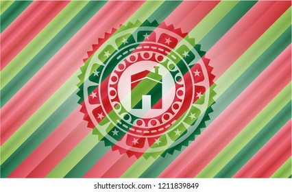 house icon inside christmas colors style badge.