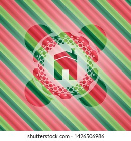house icon inside christmas colors badge.