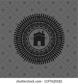 house icon inside dark badge or emblem
