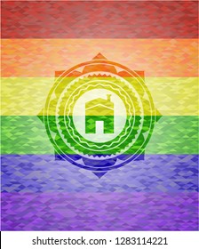 house icon inside emblem on mosaic background with the colors of the LGBT flag