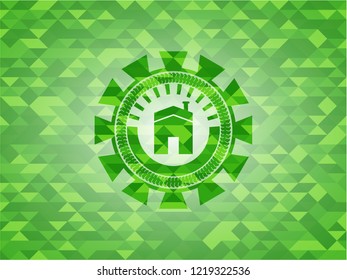 house icon inside green emblem with mosaic ecological style background