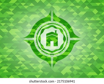 Haussymbol in einem realistischen grünen Mosaik-Emblem. 