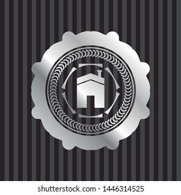 house icon inside silver badge or emblem