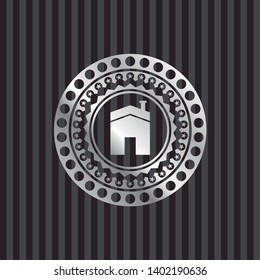 house icon inside silvery emblem