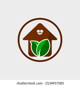 Casa con símbolo de hoja y plantilla de diseño de ventanas en forma de corazón