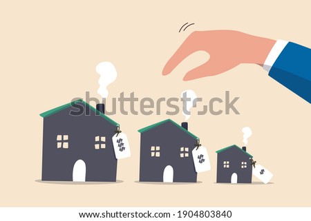 House or mortgage affordability calculation, picking new home base on budget, income or lifestyle concept, businessman hand wisely think to picking different variant houses with price tag.