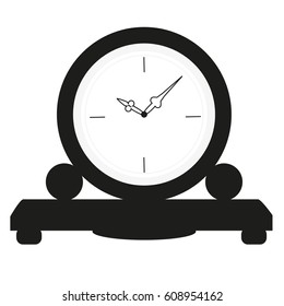 A house old style clock staying at the little table black and white 