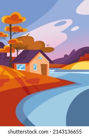 House on the lake in autumn season. Nature landscape in portrait format.