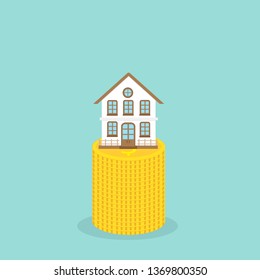 house on stack of coins. Concept of saving and Investment property