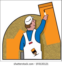 A house painter covers a wall with paint.
