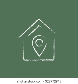 House with pointer hand drawn in chalk on a blackboard vector white icon isolated on a green background.