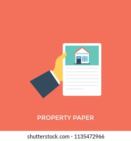 
A house print on a document showing property contract holding in hand
