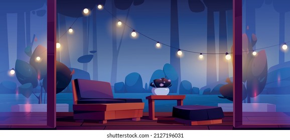 House terrace with table, couch, string lights and view to dark garden at night. Vector cartoon illustration of wooden veranda with glass walls and forest or park landscape with trees at evening