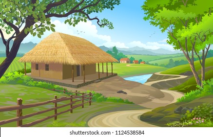 A house in a village with roof made of straws and walls made of clay.