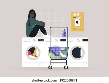 Household chores concept, a young female Black character waiting for their laundry in a coin laundromat