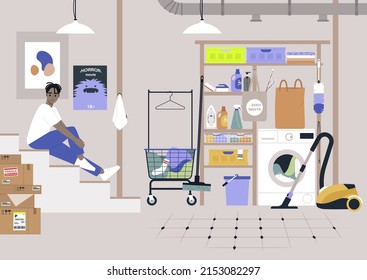 Household storage room in a basement, laundry and cleaning appliances, detergents, buckets and baskets, a young male African character sitting on the stairs