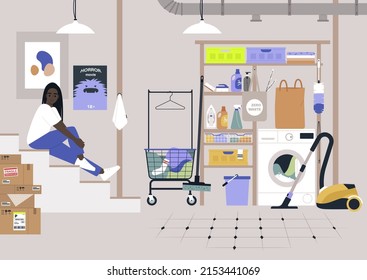 Almacén doméstico en un sótano, lavadoras y aparatos de limpieza, detergentes, baldes y canastos, una joven personaje africana sentada en las escaleras