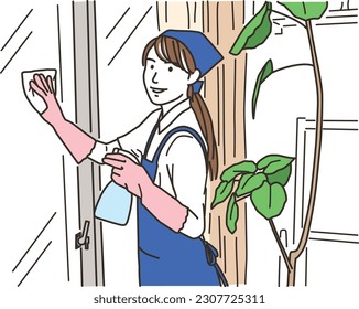 A housekeeper woman in an apron who wipes windows
