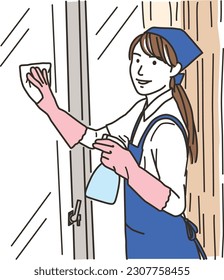 A housekeeper woman in an apron who wipes windows
