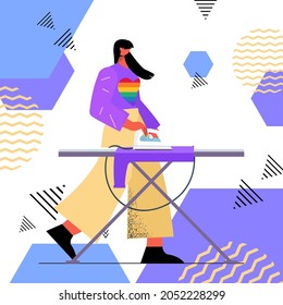 housewife ironing clothes woman wearing rainbow LGBT sweater transgender love housework concept