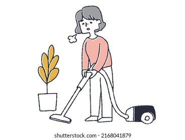 Housewife sighing while vacuuming A woman chased by daily chores