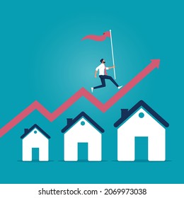 Housing price rising up, real estate investment or property growth concept, businessman holding flag running on rising house graph