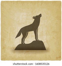 Howling wolf stands on rock vintage background