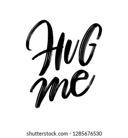 HUG ME. MODERN BRUSH CALLIGRAPHY. ISOLATED ON WHITE BACKGROUND. VECTOR HAND LETTERING