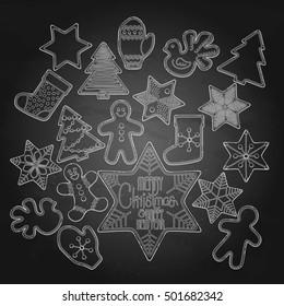 Huge collection of graphic Christmas gingerbread drawn in line art style. Vector design elements isolated on the chalkboard.