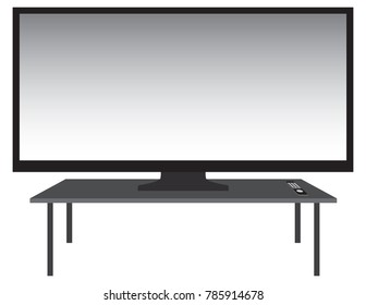 A huge flat screen television with remote is resting on a stand