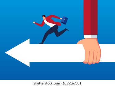 Huge hand holds arrow giving direction to businessman