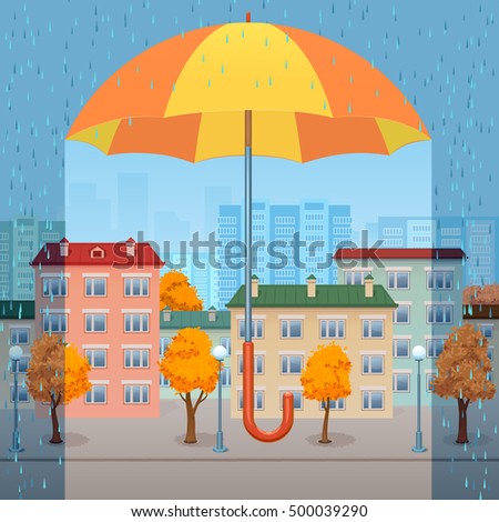the huge yellow-orange umbrella protects the autumn city from a rain
