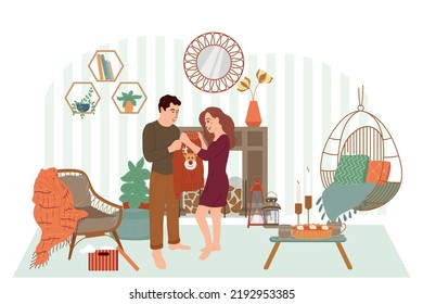 Hugge lifestyle flat composition with living room interior soft furniture and loving couple giving warm clothes vector illustration