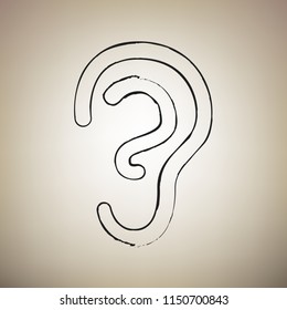 Human anatomy. Ear sign. Vector. Brush drawed black icon at light brown background.