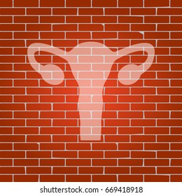Human anatomy. Uterus sign. Vector. Whitish icon on brick wall as background.