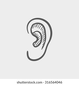 Human ear sketch icon for web, mobile and infographics. Hand drawn vector dark grey icon isolated on light grey background.