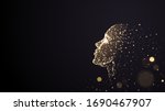 Human face on a black background of gold glowing particles
